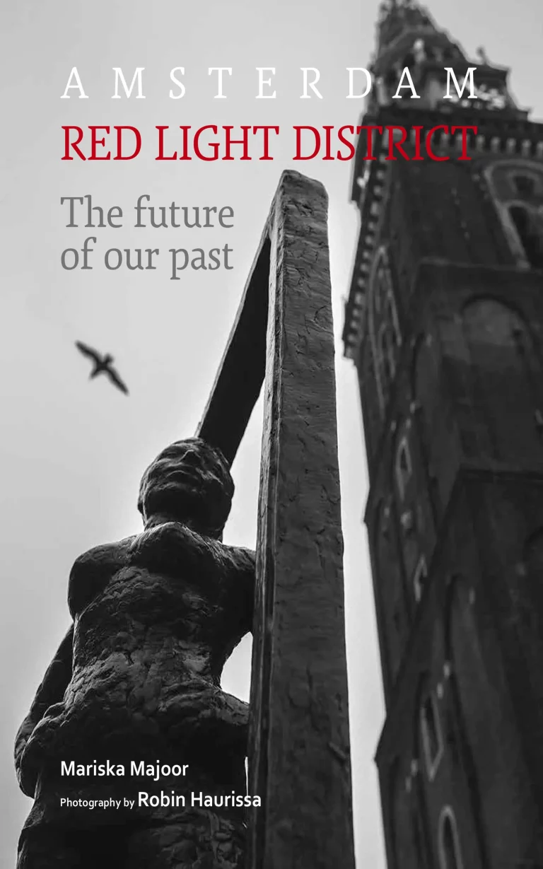 A black-and-white picture of the Belle statue with the Old Church tower in the background